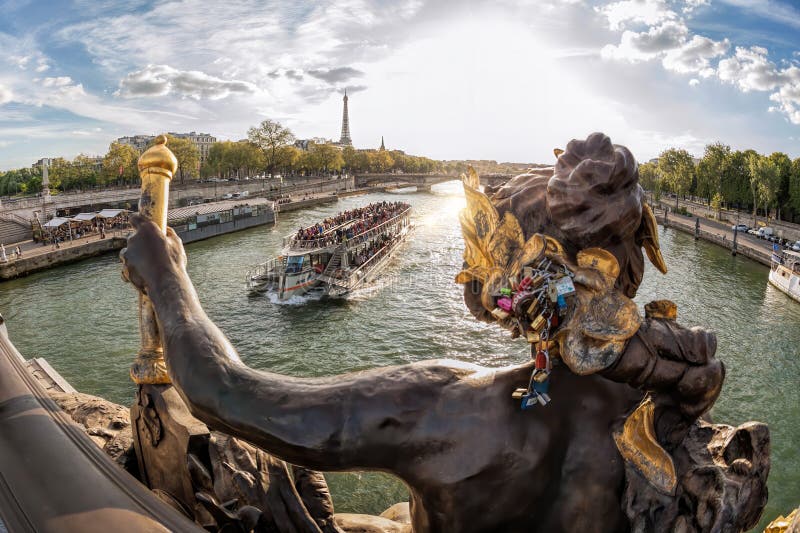The Pont Alexandre III (bridge) with Sculptures Against Tourist Boat on ...