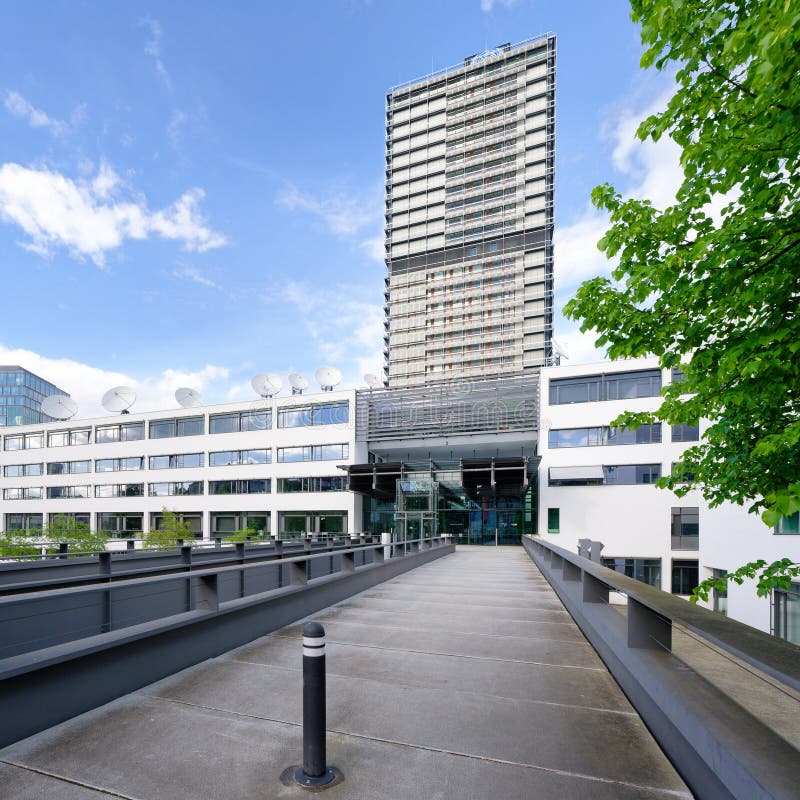 Bonn, Germany May 03 2024: entrance via the bridge to deutsche welle in bonn in front of the un campus tower block. Bonn, Germany May 03 2024: entrance via the bridge to deutsche welle in bonn in front of the un campus tower block