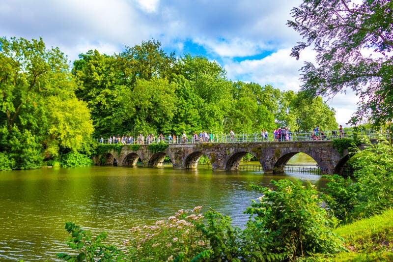 Bridge of Love built in 1740 over Minnewater lake in Bruges, Belgium, fairytale scenery in Bruges. Bruges historic city centre is a prominent World Heritage Site of UNESCO.August 7th 2016. Bridge of Love built in 1740 over Minnewater lake in Bruges, Belgium, fairytale scenery in Bruges. Bruges historic city centre is a prominent World Heritage Site of UNESCO.August 7th 2016