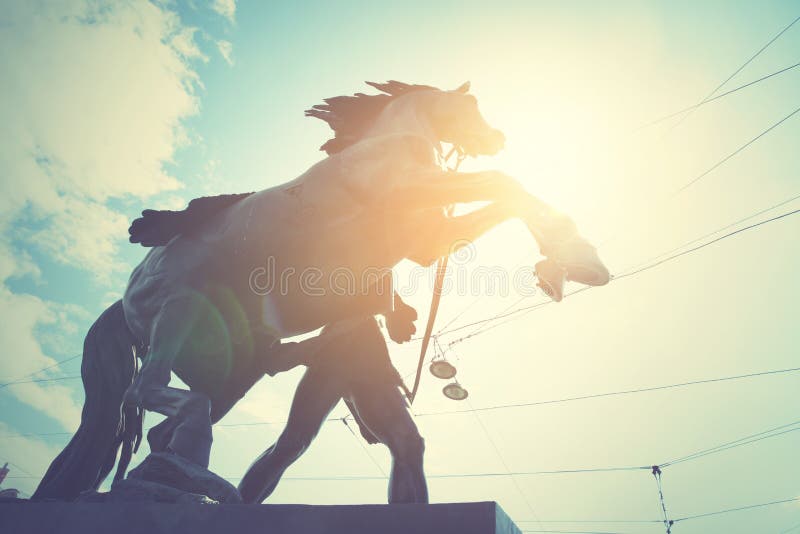 Horse tamers sculpture 1851 by Peter Klodt on Anichkov Bridge in Saint-Petersburg, Russia. Retro style filtered image. Horse tamers sculpture 1851 by Peter Klodt on Anichkov Bridge in Saint-Petersburg, Russia. Retro style filtered image