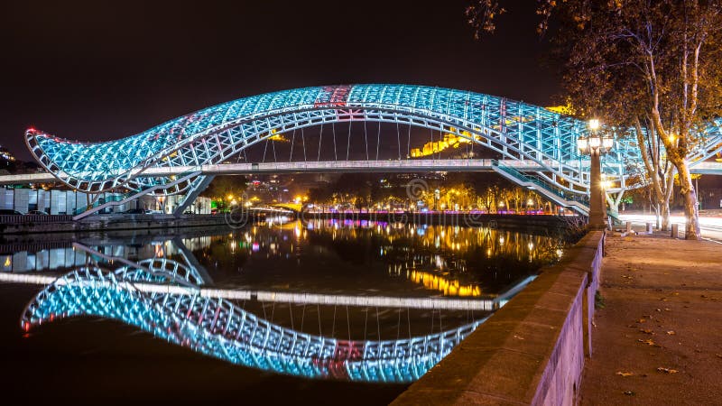 Pedestrian bridge of peace over the Mtkvari Kura River in Tbilisi - night shot. Pedestrian bridge of peace over the Mtkvari Kura River in Tbilisi - night shot.