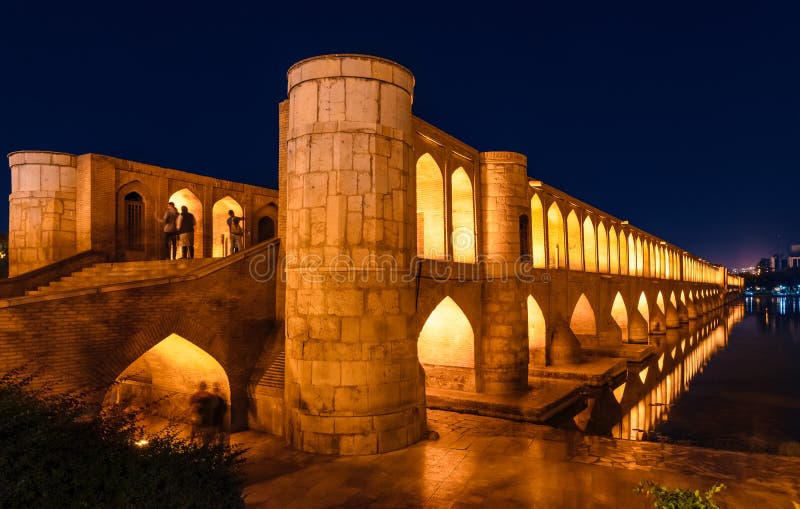 Si-o-Se Pol (Bridge of 33 Arches or Allahverdi Khan Bridge) at night on Zayanderud River in Isfahan, Iran. Architectural masterpiece and historical heritage. Tourist attraction. Si-o-Se Pol (Bridge of 33 Arches or Allahverdi Khan Bridge) at night on Zayanderud River in Isfahan, Iran. Architectural masterpiece and historical heritage. Tourist attraction.