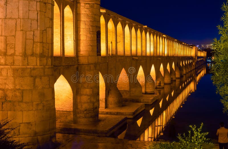 Si-o-Se Pol (Bridge of 33 Arches or Allahverdi Khan Bridge) at night on Zayanderud River in Isfahan, Iran. Architectural masterpiece and historical heritage. Tourist attraction. Si-o-Se Pol (Bridge of 33 Arches or Allahverdi Khan Bridge) at night on Zayanderud River in Isfahan, Iran. Architectural masterpiece and historical heritage. Tourist attraction.