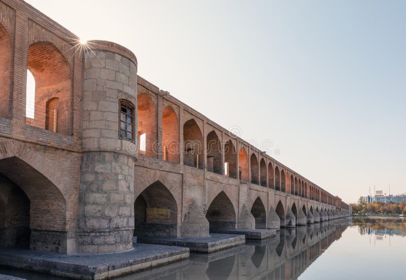 Si-o-Se Pol (Bridge of 33 Arches or Allahverdi Khan Bridge) on Zayanderud River in Isfahan, Iran. Architectural masterpiece and historical heritage. Tourist attraction. Si-o-Se Pol (Bridge of 33 Arches or Allahverdi Khan Bridge) on Zayanderud River in Isfahan, Iran. Architectural masterpiece and historical heritage. Tourist attraction.