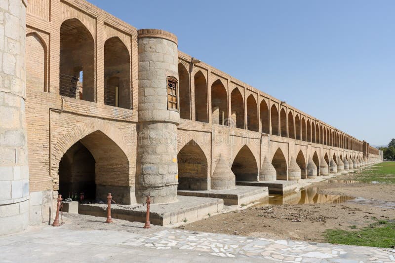 Isfahan, Iran - July 31 2023: Si-o-se-pol Bridge. The famous two-storey stone bridge with 33 arches over the Zayandeh River in Isfahan. Isfahan, Iran - July 31 2023: Si-o-se-pol Bridge. The famous two-storey stone bridge with 33 arches over the Zayandeh River in Isfahan.