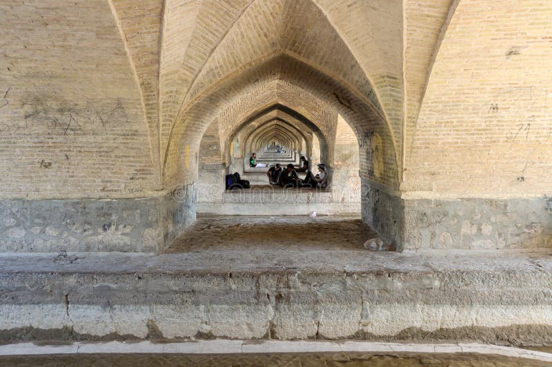 Isfahan, Iran - July 31 2023: Si-o-se-pol Bridge. The famous two-storey stone bridge with 33 arches over the Zayandeh River in Isfahan. Isfahan, Iran - July 31 2023: Si-o-se-pol Bridge. The famous two-storey stone bridge with 33 arches over the Zayandeh River in Isfahan.