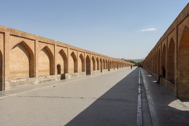 Isfahan, Iran - July 31 2023: Si-o-se-pol Bridge. The famous two-storey stone bridge with 33 arches over the Zayandeh River in Isfahan. Isfahan, Iran - July 31 2023: Si-o-se-pol Bridge. The famous two-storey stone bridge with 33 arches over the Zayandeh River in Isfahan.