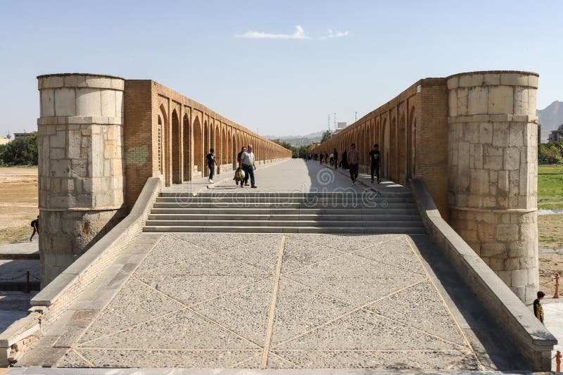 Isfahan, Iran - July 31 2023: Si-o-se-pol Bridge. The famous two-storey stone bridge with 33 arches over the Zayandeh River in Isfahan. Isfahan, Iran - July 31 2023: Si-o-se-pol Bridge. The famous two-storey stone bridge with 33 arches over the Zayandeh River in Isfahan.