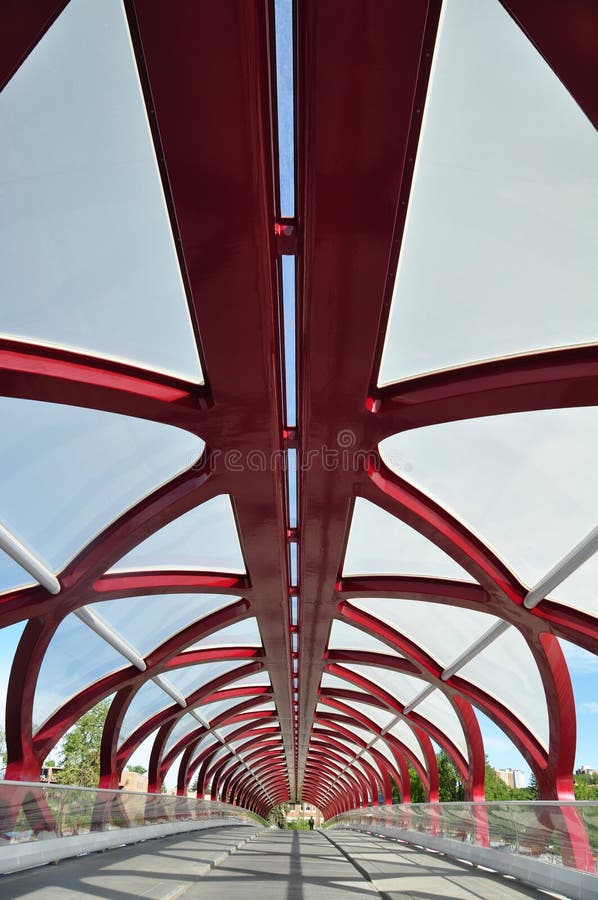 Calgary, Canada -June 7, 2012: Inside Calgary's Peace Bridge which spans the Bow River between downtown and Sunnyside neighbourhood. The helix shaped metal bridge makes for interesting patterns. Calgary, Canada -June 7, 2012: Inside Calgary's Peace Bridge which spans the Bow River between downtown and Sunnyside neighbourhood. The helix shaped metal bridge makes for interesting patterns.