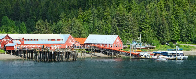 A sunny profile view of the Icy Strait Point old historic cannery and cruise ship visitors center near Hoonah, Alaska on Chichagof Island. Icy Strait Point itself is owned by local native Tlingit tribe members, and Hoonah is the largest Tlingit community in the Pacific Northwest. A sunny profile view of the Icy Strait Point old historic cannery and cruise ship visitors center near Hoonah, Alaska on Chichagof Island. Icy Strait Point itself is owned by local native Tlingit tribe members, and Hoonah is the largest Tlingit community in the Pacific Northwest.
