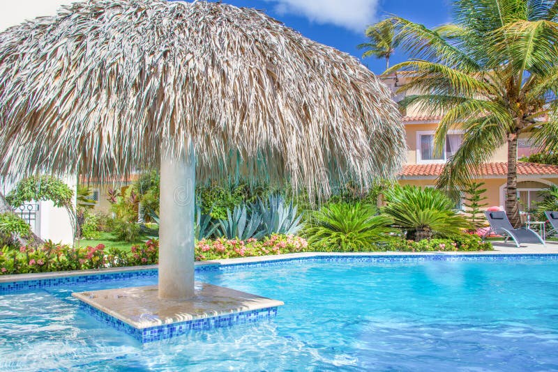 Pool at a beautiful house surrounded by tropical greenery on a sunny day. stock photography Pool at a beautiful house surrounded by tropical greenery on a sunny day. stock photography