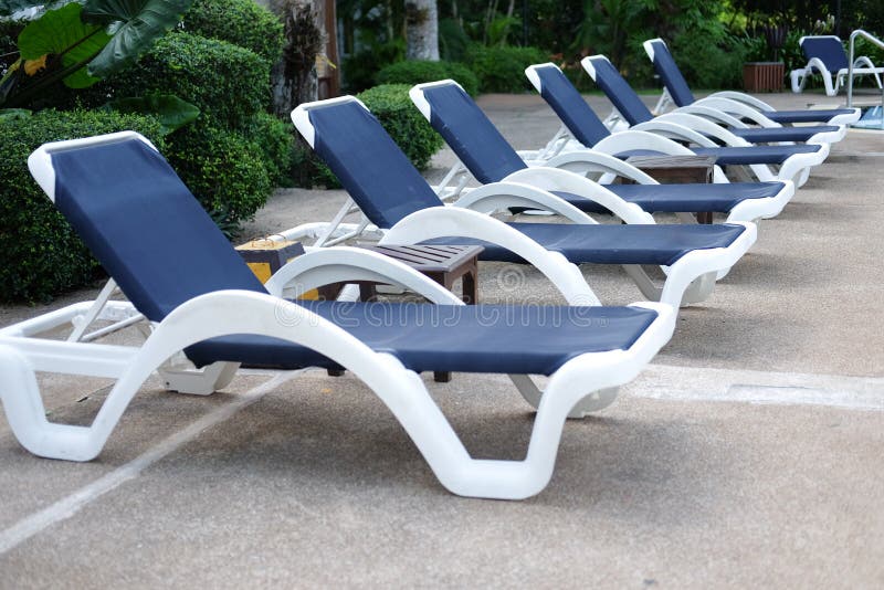 Pool chair relaxing stock photo. Image of leisure, luxury 81152362