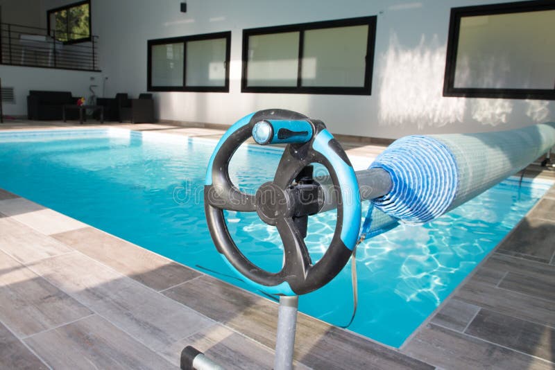 Pool Cover Bubble Solar Rolled Up on a Roller Stock Photo Image of