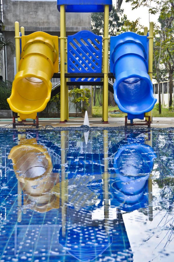 Colorful pool sliders on pool side. Colorful pool sliders on pool side.