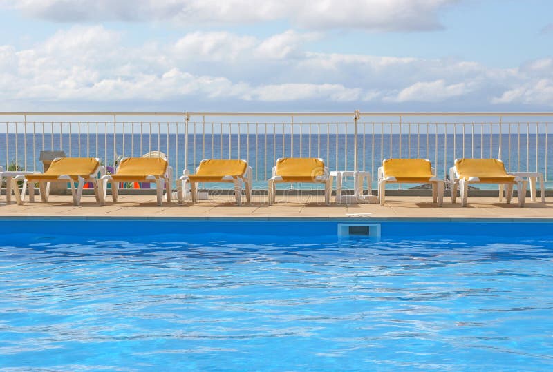 Pool Sunbeds Around A Pool Picture. Image 3873740
