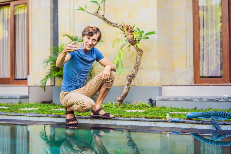 Pool worker checks the pool for safety. Measurement of chlorine and PH of a pool royalty free stock photos Pool worker checks the pool for safety. Measurement of chlorine and PH of a pool royalty free stock photos