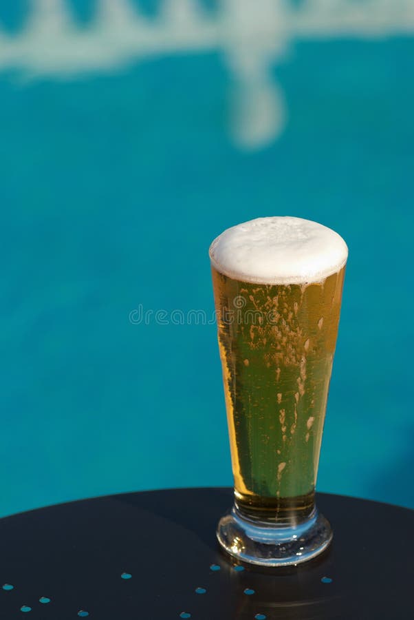 Poolside beer stock photo. Image of foamy, lager, table 16311796