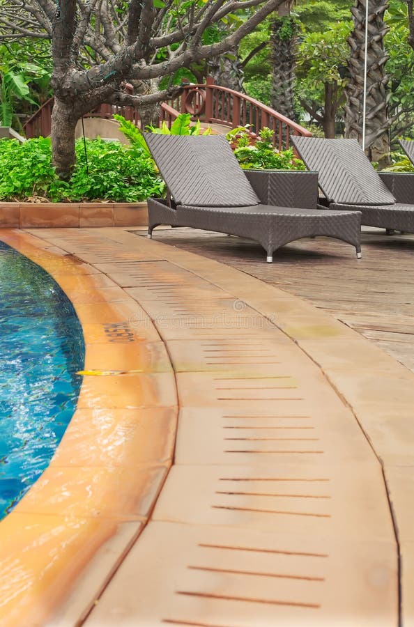 Poolside loungers stock photography