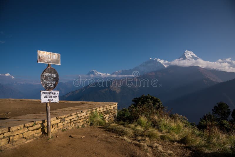 Poon hill altitude sign with Annapurna range in background, Nepal. royalty free stock image Poon hill altitude sign with Annapurna range in background, Nepal. royalty free stock image