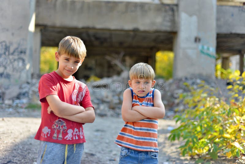 Poor and dirty street children living on an abandoned construction site royalty free stock photos Poor and dirty street children living on an abandoned construction site royalty free stock photos