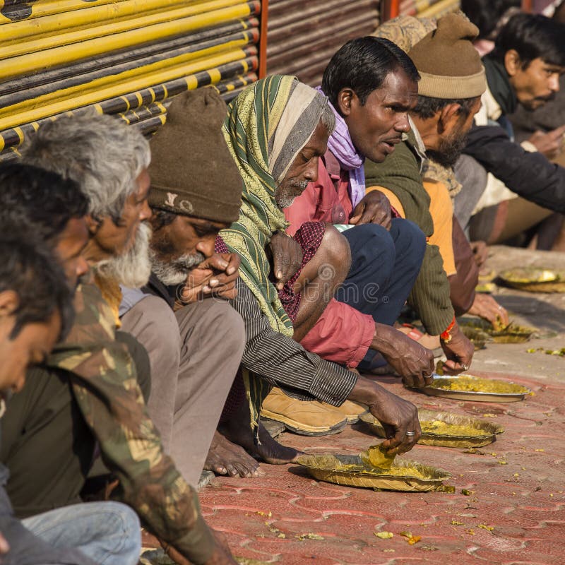 poor-indian-people-eating-free-food-street-varanasi-india-january-unidentified-near-river-ganges-94650651.jpg