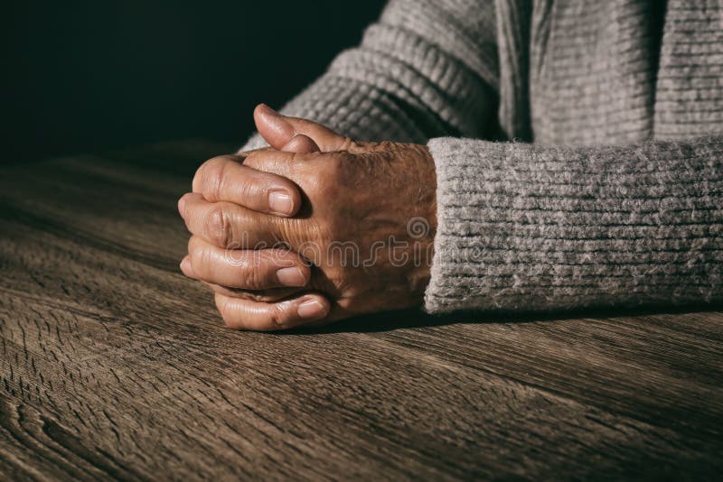 Poor senior woman at table, closeup stock images