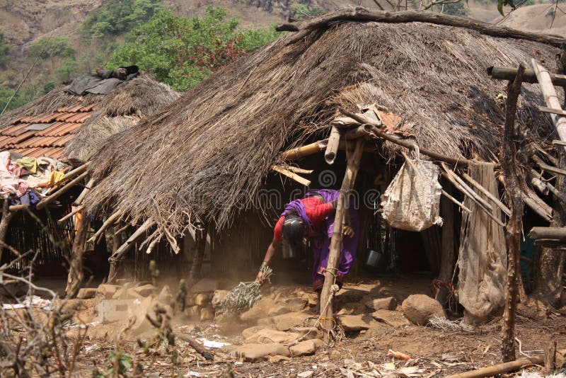 Poor Woman Cleaning Hut
