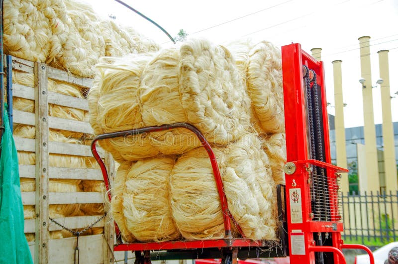 POPAYAN, COLOMBIA - FEBRUARY 06, 2018: Close up of red truck full of hay straw bales, ready for transportation, located