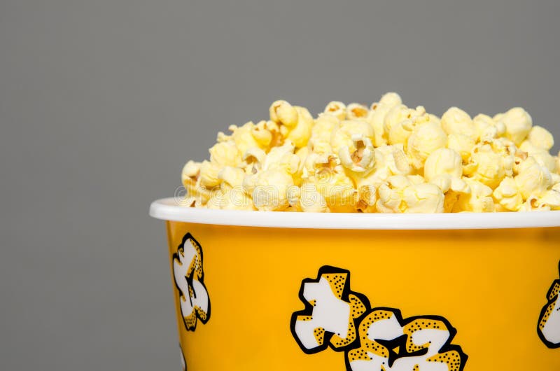 Popcorn bucket overflowing royalty free stock photo