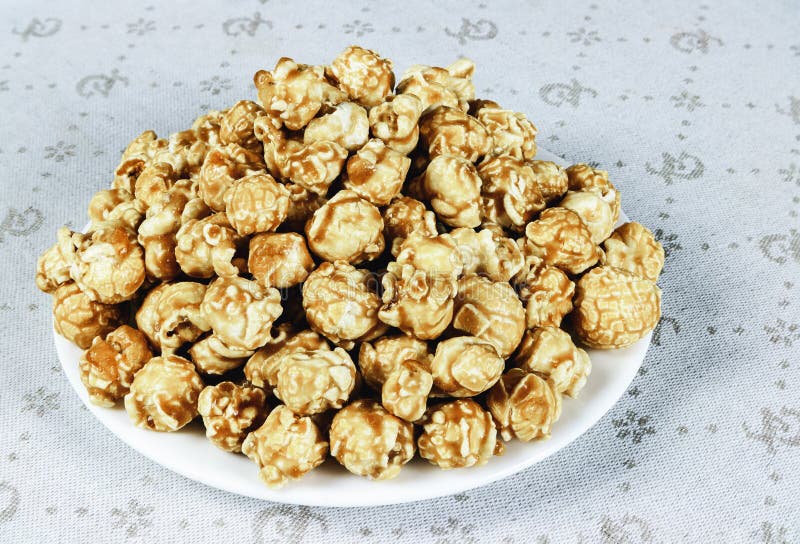 Popcorn with caramel glaze stock photo. Image of confectionary 209962232