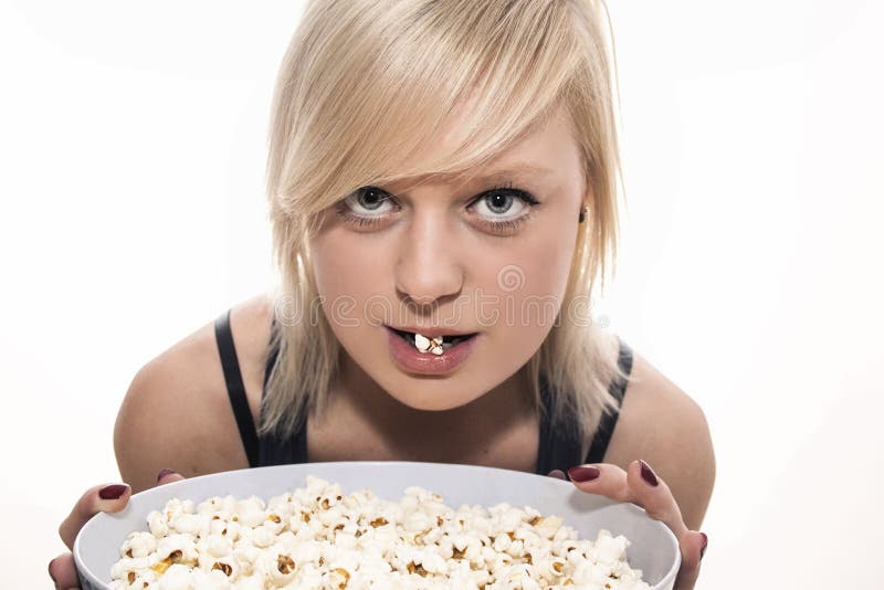 Girl Eating Popcorn stock photo. Image of bite, people 59104696