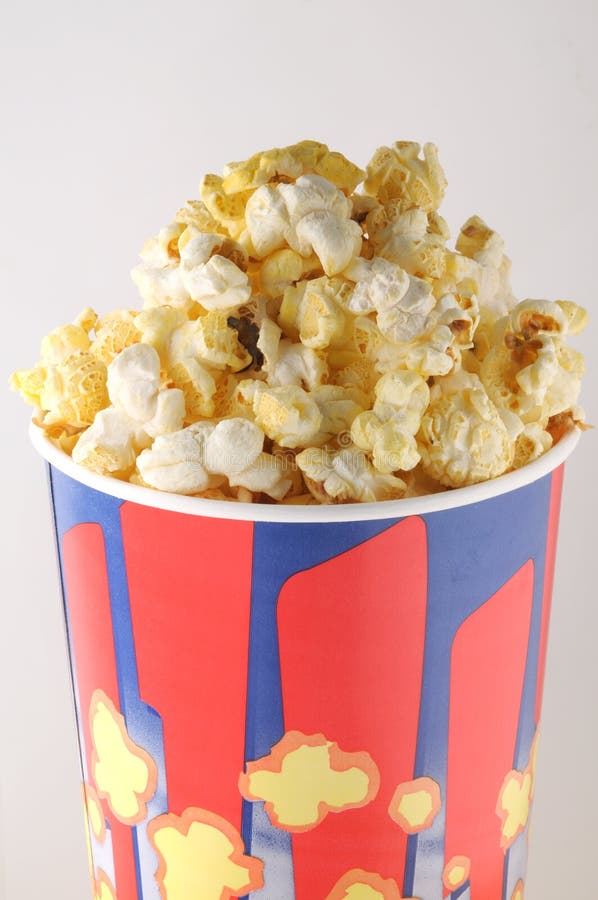 Popcorn in a paper cup stock image