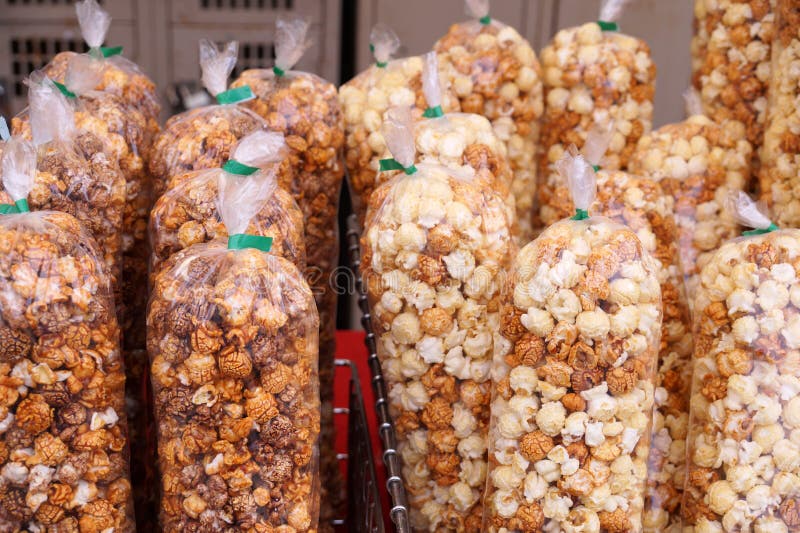 Different Types of Popcorn Kettle, Caramel, Chocolate. Popcorn Stall at the Stadium Stock Photo