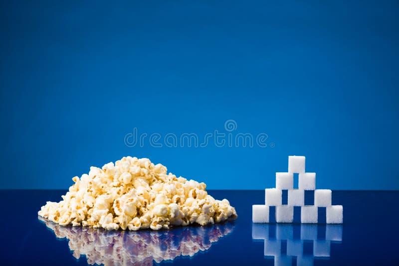 Popcorn and sugar stock image. Image of blue, cube, heap 41473059