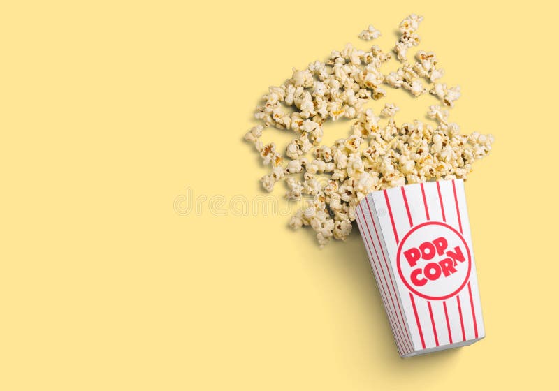 Popcornlebensmittel im Kasten auf hellem Hintergrund lizenzfreies stockbild Popcornlebensmittel im Kasten auf hellem Hintergrund lizenzfreies stockbild