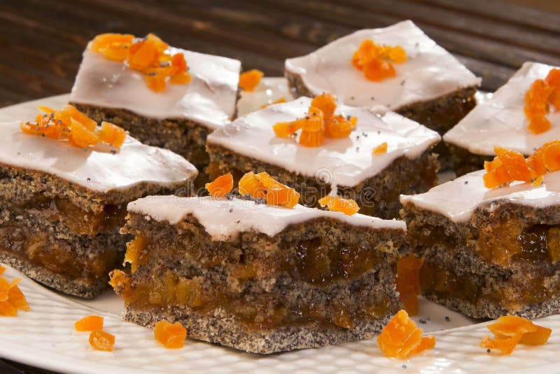 Poppy seed, orange cake, nicely served.