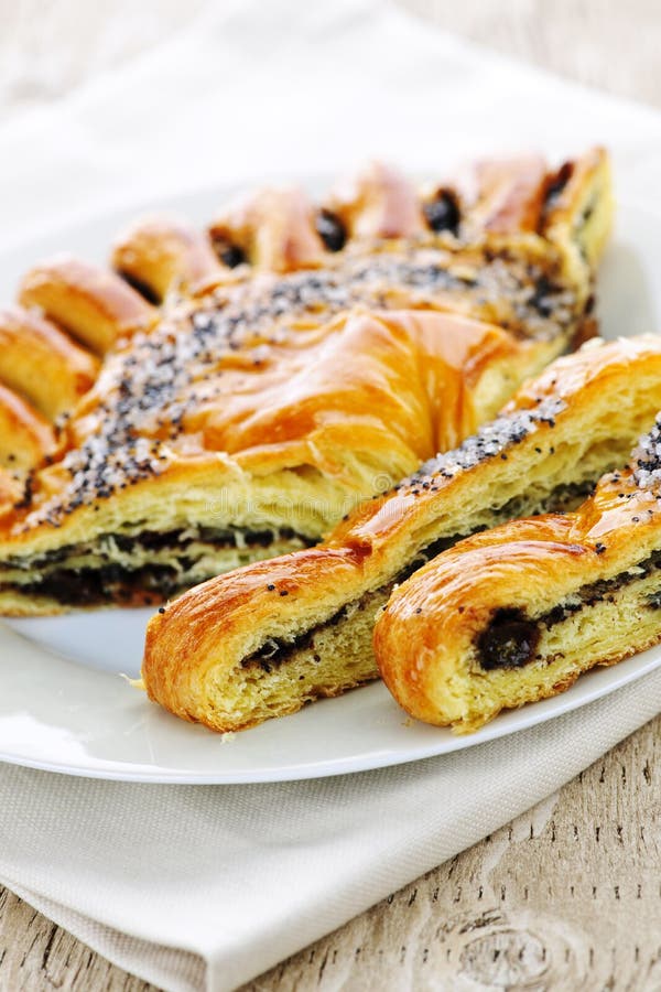 Closeup of poppy seed strudel dessert pastry with slices. Dessert portions stock images, royalty-free photos and pictures