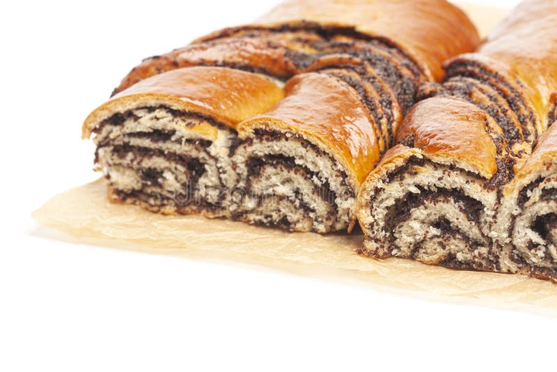 Poppy Seed Strudel on a Brown Baking Paper Isolated on White Stock