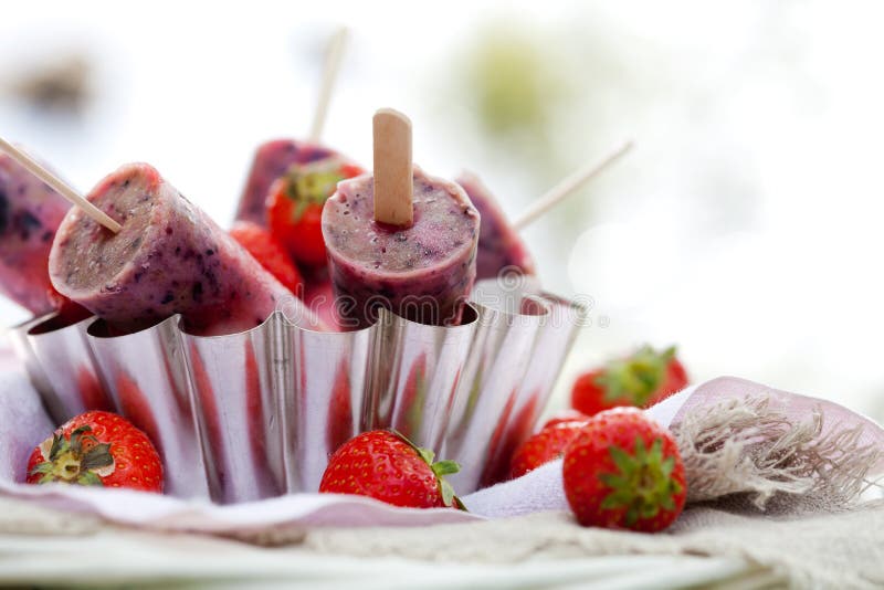 Popsicle with yogurt, blueberries and strawberries. Popsicle with yogurt, blueberries and strawberries