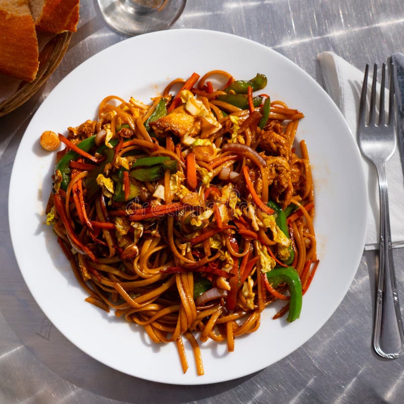 Stir Fried Noodles Soba with Vegetables, Chicken and Omelette Stock