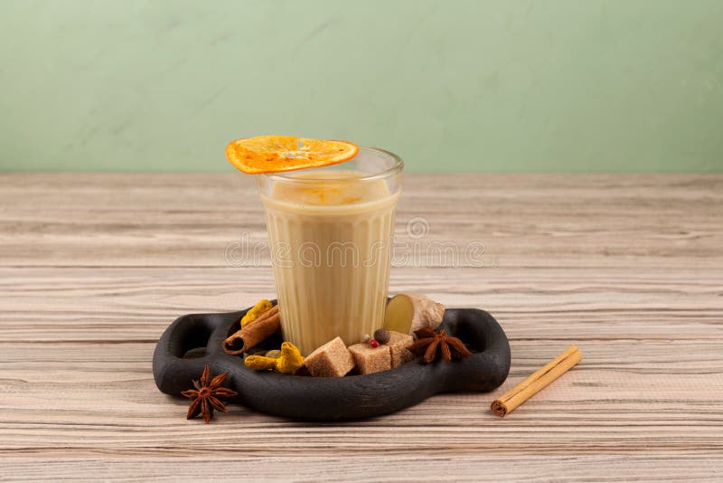https://thumbs.dreamstime.com/b/popular-indian-drink-karak-tea-masala-chai-prepared-addition-milk-variety-spices-glass-wooden-table-next-188097975.jpg