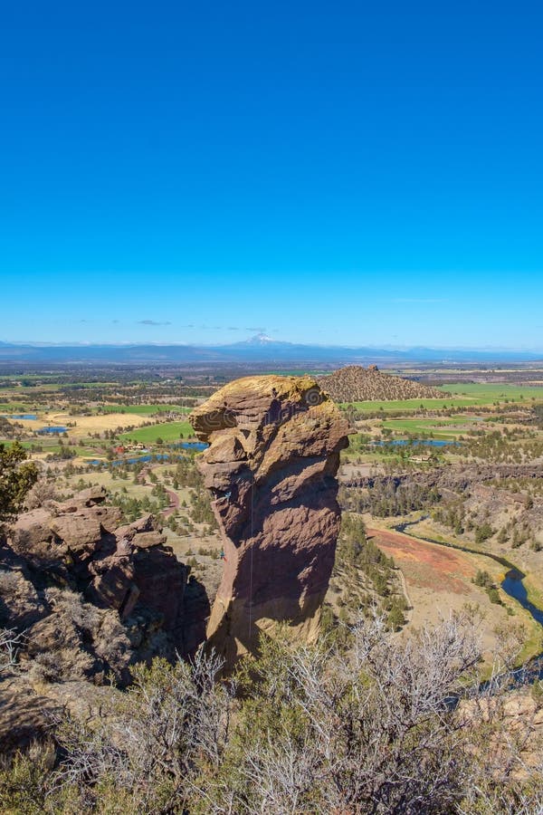 The popular Monkey Face vertical rock face, Smith Rock State Park, which commands excellent views of the area and the distant Cascade Mountains. Red face monkey stock images, royalty-free photos and pictures