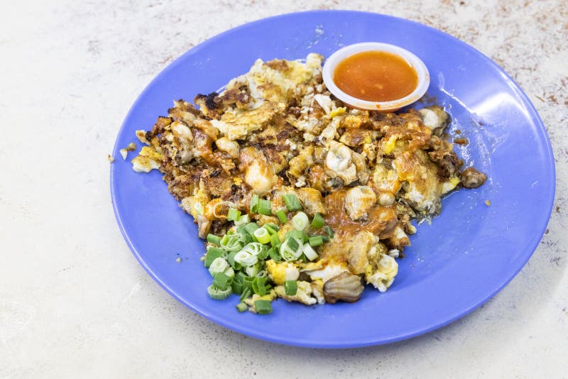 Popular Penang Fried Oyster Omelette Egg Served with Chilli Dip Stock