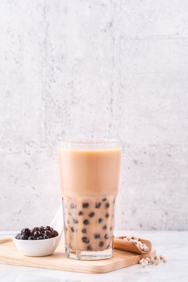 A glass cup of pearl milk tea (also called bubble tea) and a plate of  tapioca ball on white background. Pearl milk tea is the most representative  drin Stock Photo - Alamy