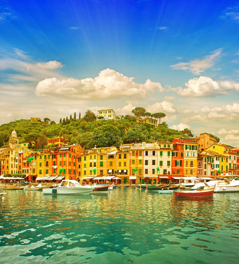 Beautiful sunset in Portofino village on Ligurian coast, Italy. mediterranean sea landscape. Vibrant colors with sun shine effect. Beautiful sunset in Portofino village on Ligurian coast, Italy. mediterranean sea landscape. Vibrant colors with sun shine effect