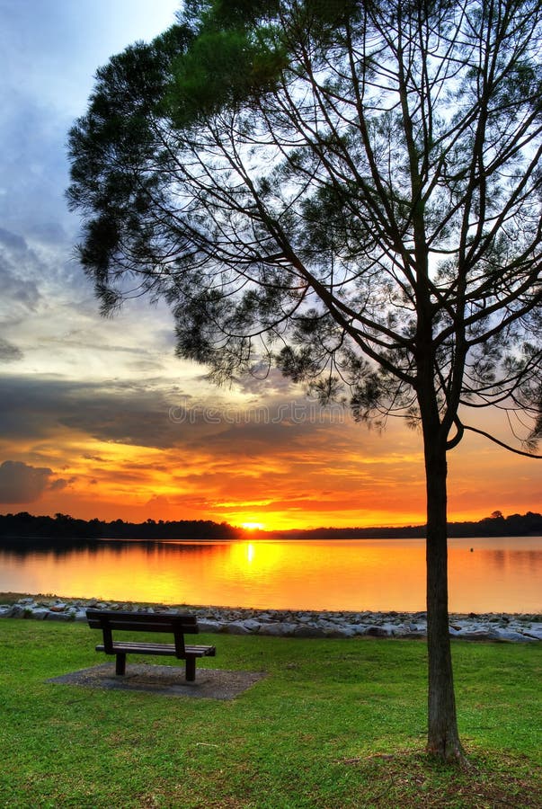 The sun set at the horizon of this reservoir with all the colors it can shine for the last moment in the day. The sun set at the horizon of this reservoir with all the colors it can shine for the last moment in the day.