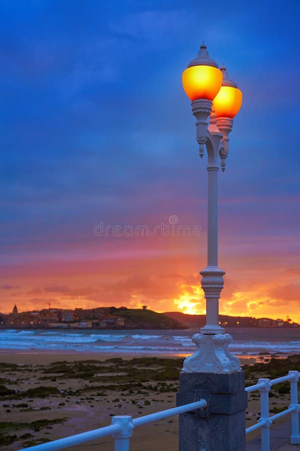 Gijon skyline sunset in San Lorenzo beach of Asturias in Spain. Gijon skyline sunset in San Lorenzo beach of Asturias in Spain