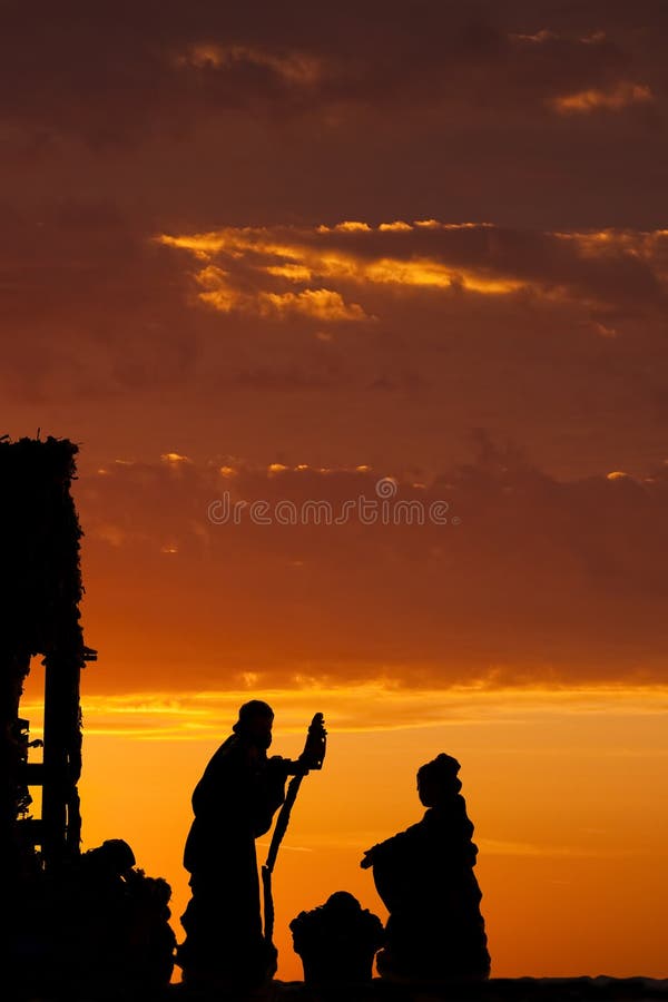 Silhouetted nativity scene set against a dramatic sunrise. Silhouetted nativity scene set against a dramatic sunrise