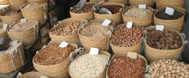 Baskets with various kinds of nuts in a village market in Tunisia. Baskets with various kinds of nuts in a village market in Tunisia