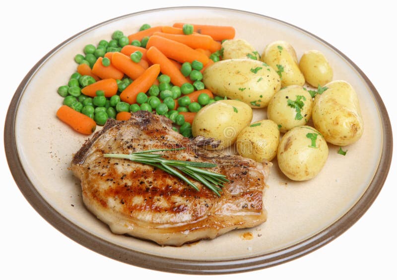 Pork Chop With New Potatoes And Vegetables Stock Image - Image of